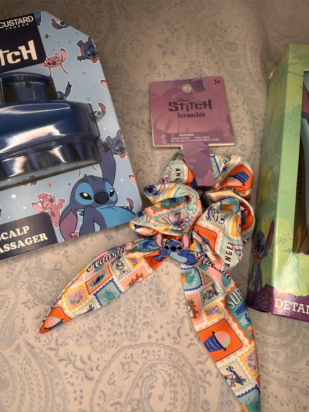Disney Stitch Scalp Massager, Detangler Brush, and Metal Stich on Satin Scrunch